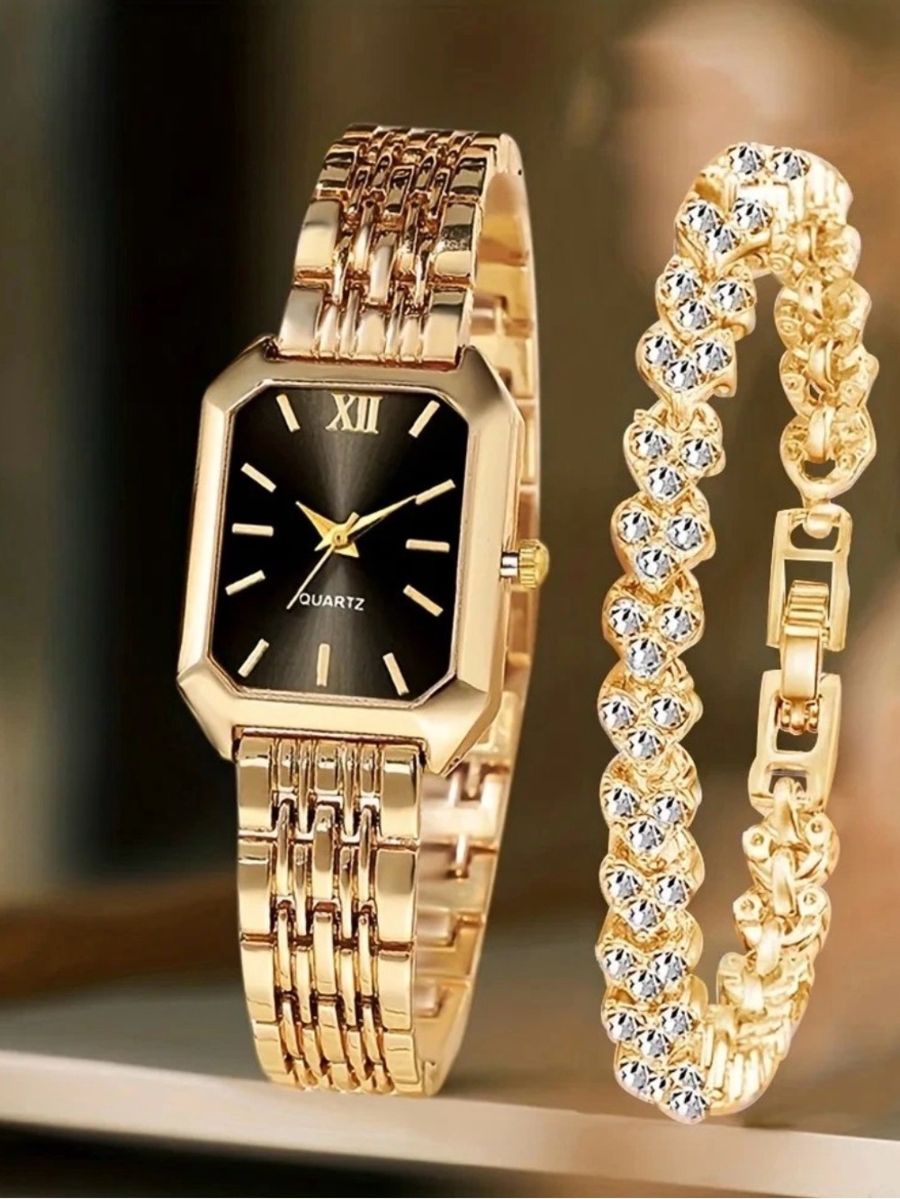 Gold Tone Women's Quartz Watch with Black Dial and Crystal Bracelet